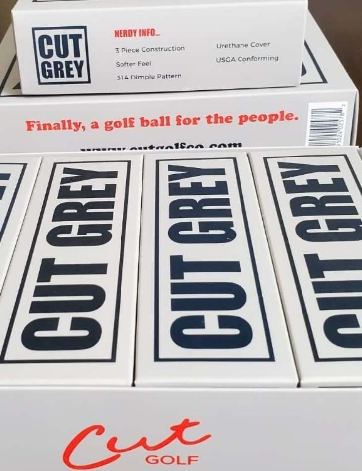 Boxes and Sleeves of Cut Grey Golf Balls