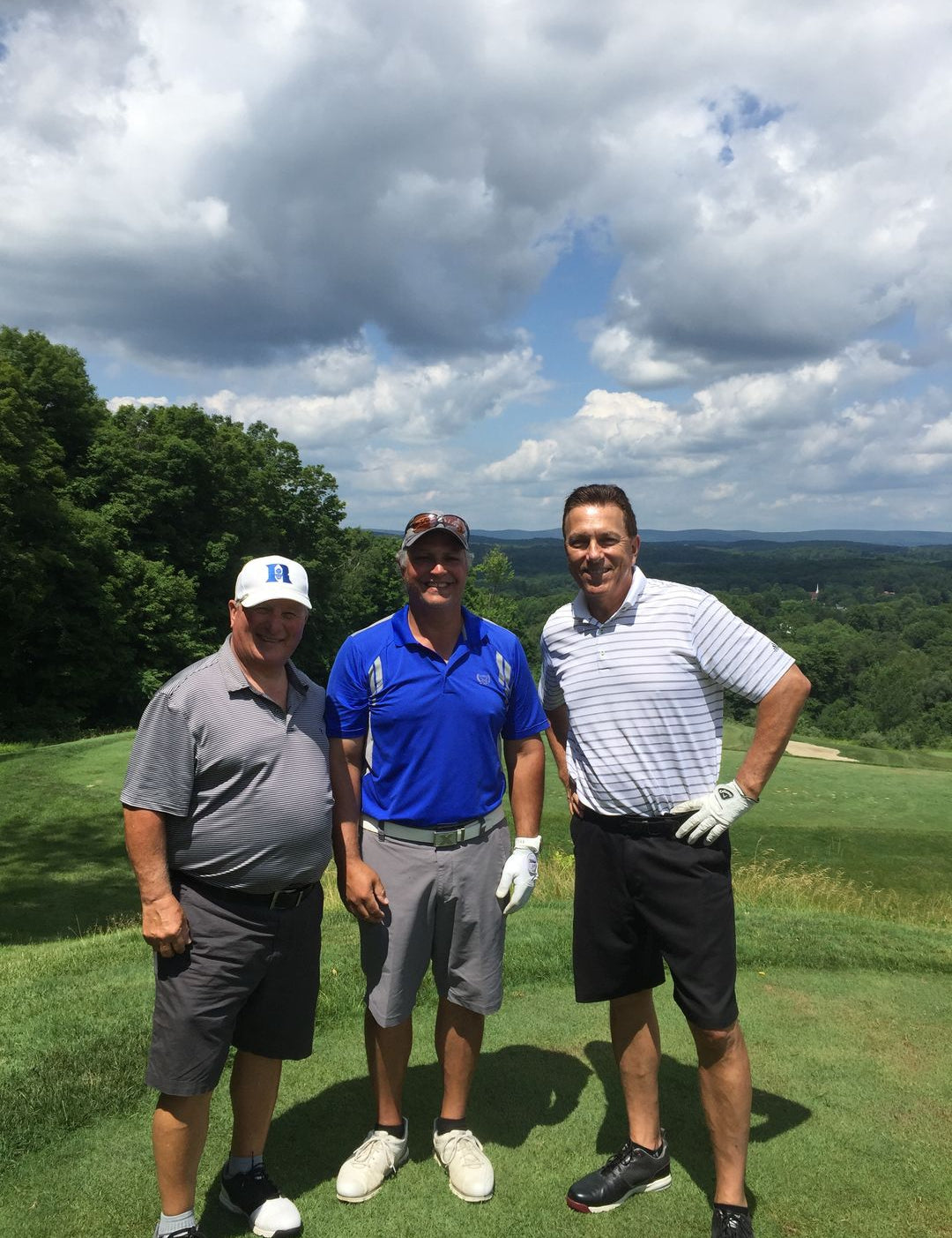 Three Amateur Golfers Standing On a Tee