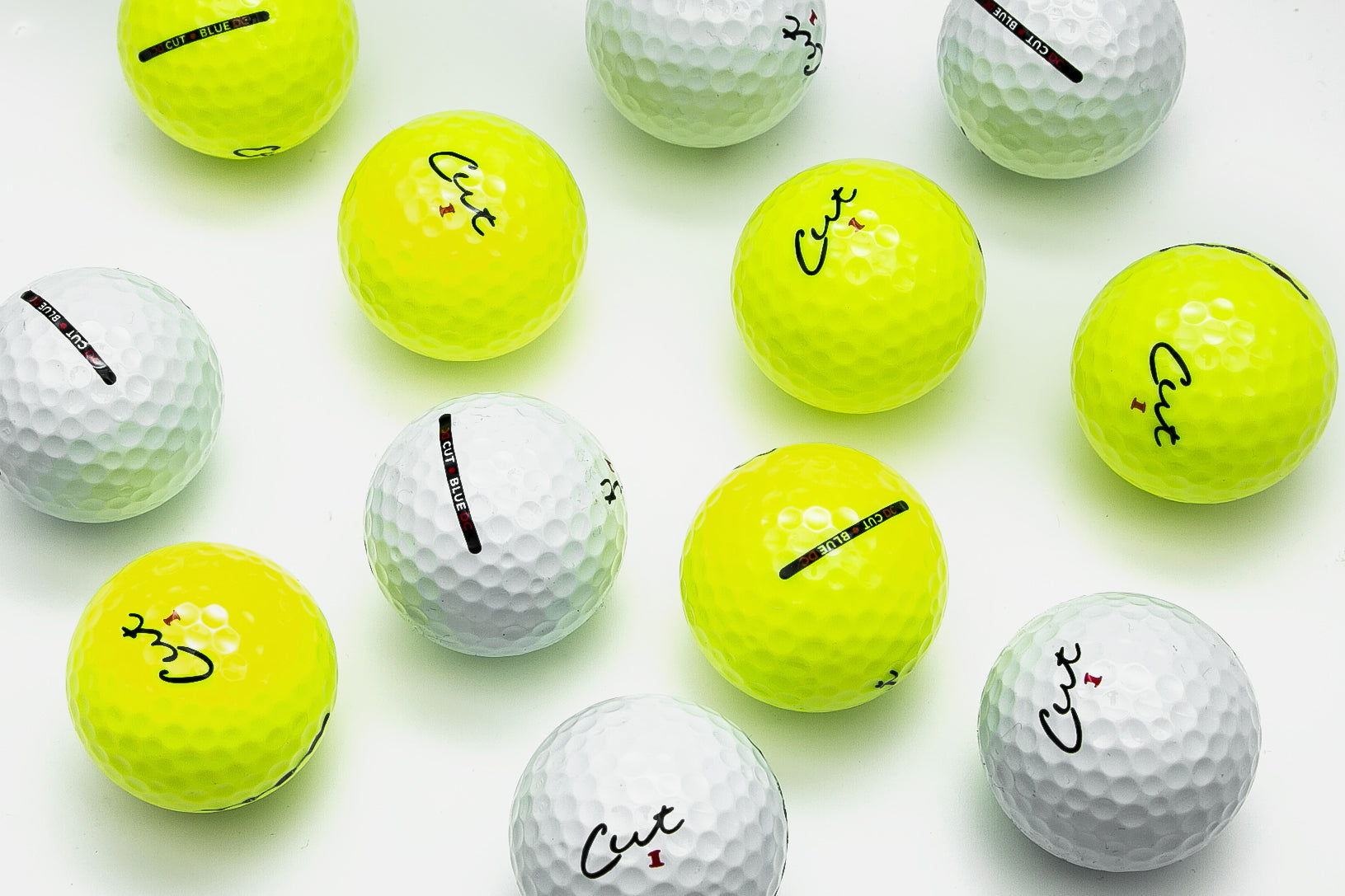 Cut DC Golf Ball White and Yellow Balls