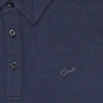 Cut Golf Logo Closeup on the Logan Navy Polo Shirt