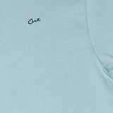Cut Golf Logo Closeup on the Game Day Pale Blue Polo Shirt